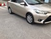 Toyota Vios   1.5 E  2015 - Cần bán Toyota Vios 1.5 E 2015, màu vàng