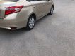 Toyota Vios   1.5 E  2015 - Cần bán Toyota Vios 1.5 E 2015, màu vàng