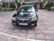 Mazda 323 2004 - Cần bán gấp Mazda 323 đời 2004, màu đen còn mới, 135 triệu