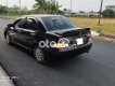 Mitsubishi Lancer 2003 - Cần bán xe Mitsubishi Lancer sản xuất năm 2003, màu đen còn mới giá cạnh tranh