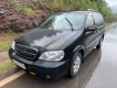 Kia Carnival   GS 2.5 AT  2009 - Cần bán Kia Carnival GS 2.5 AT năm sản xuất 2009, màu đen, 215 triệu