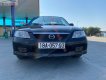 Mazda 323   1.6MT 2004 - Cần bán xe Mazda 323 1.6MT năm sản xuất 2004, màu đen chính chủ