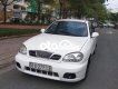 Daewoo Lanos MT 2003 - Cần bán gấp Daewoo Lanos MT năm 2003, màu trắng, nhập khẩu nguyên chiếc, giá chỉ 80 triệu