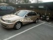 Ford Laser    MT 2002 - Cần bán Ford Laser MT năm 2002, màu vàng, giá chỉ 115 triệu