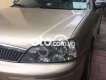 Ford Laser    MT 2002 - Cần bán Ford Laser MT năm 2002, màu vàng, giá chỉ 115 triệu