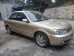 Ford Laser 2002 - Bán Ford Laser sản xuất 2002, màu vàng cát