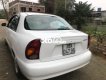 Daewoo Lanos 2002 - Cần bán gấp Daewoo Lanos sản xuất năm 2002, màu trắng, xe nhập