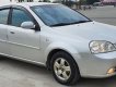 Daewoo Lacetti MT 2005 - Cần bán gấp Daewoo Lacetti MT năm 2005, màu bạc xe gia đình