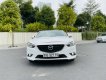 Mazda 6 2014 - Cần bán gấp Mazda 6 2.0AT, năm sản xuất 2014, màu trắng, chủ dùng rất cẩn thận, giữ gìn, xe nguyên bản 100%