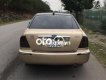 Ford Laser    MT 2002 - Bán Ford Laser MT năm 2002, màu vàng