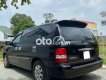 Kia Carnival     2007 - Bán ô tô Kia Carnival năm sản xuất 2007, màu đen xe gia đình, giá chỉ 200 triệu