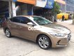 Hyundai Elantra 2016 - Cần bán xe Hyundai Elantra GLS 2.0 AT năm sản xuất 2016, màu vàng cát