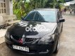 Mitsubishi Lancer 2003 - Bán ô tô Mitsubishi Lancer năm sản xuất 2003, màu đen số tự động, 185tr