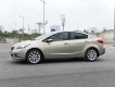 Kia K3 2014 - Cần bán gấp Kia K3 1.6AT sản xuất năm 2014, màu vàng cát, giá cạnh tranh