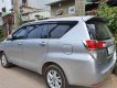 Toyota Innova 2016 - Cần bán lại xe Toyota Innova 2.0E sản xuất năm 2016, màu bạc xe gia đình