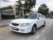 Mazda 323 2004 - Cần bán lại xe Mazda 323 sản xuất năm 2004, màu trắng