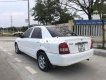 Mazda 323 2004 - Cần bán lại xe Mazda 323 sản xuất năm 2004, màu trắng