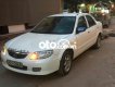 Mazda 323 2003 - Màu trắng chính chủ