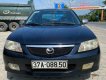 Mazda 323 2003 - Màu đen chính chủ, 120 triệu