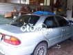 Mazda 323 2001 - Màu bạc xe gia đình, giá chỉ 90 triệu