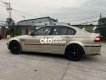 BMW 318i 2002 - Bán xe BMW 318i sản xuất năm 2002, màu vàng