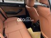 BMW 318i 2002 - Bán xe BMW 318i sản xuất năm 2002, màu vàng