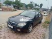 Mazda 323 Bán xe   màu đen, sx 2002. 2002 - Bán xe Mazda 323 màu đen, sx 2002.