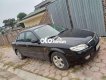 Mazda 323 Bán xe   màu đen, sx 2002. 2002 - Bán xe Mazda 323 màu đen, sx 2002.