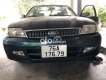 Ford Laser Nhật bản  2001 xanh xe vẫn còn nguyên rin 2001 - Nhật bản ford 2001 xanh xe vẫn còn nguyên rin