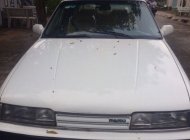 Mazda 323 1989 - Cần bán Mazda 323 đời 1989, màu trắng xe gia đình, 65 triệu giá 65 triệu tại Tp.HCM