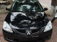 Mitsubishi Lancer 2004 - Bán Mitsubishi Lancer đời 2004, màu đen giá 285 triệu tại Bình Định