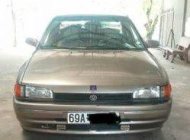 Mazda 323 1995 - Bán xe Mazda 323 đời 1995, màu vàng số sàn, 90 triệu giá 90 triệu tại Cà Mau