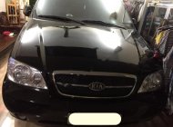 Kia Carnival GS 2006 - Gia đình cần bán xe Kia Carnival GS 2006 màu đen giá 260 triệu tại Tp.HCM