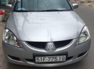 Mitsubishi Lancer 2006 - Cần bán gấp Mitsubishi Lancer đời 2006, màu bạc số sàn giá 265 triệu tại Tp.HCM