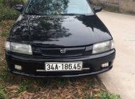 Mazda 323 MT 2000 - Bán Mazda 323 MT đời 2000, màu đen, xe nhập số sàn, 115 triệu giá 115 triệu tại Hải Dương