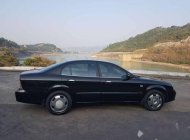 Daewoo Magnus 2004 - Bán xe Daewoo Magnus đời 2004, màu đen giá 145 triệu tại Hòa Bình