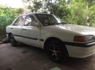 Mazda 323 1.6 MT 2001 - Cần bán gấp Mazda 323 1.6 MT năm 2001, màu trắng giá 68 triệu tại An Giang