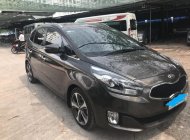 Kia Rondo AT 2015 - Bán Kia Rondo AT năm sản xuất 2015, màu nâu, máy dầu, xe 7 chỗ giá 596 triệu tại Tp.HCM