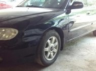 Kia Spectra 2004 - Cần bán Kia Spectra đời 2004, màu đen, máy chất nổ êm ái, máy lạnh tê tái, nội thất đẹp giá 120 triệu tại Kon Tum