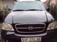 Kia Carnival   GS 2009 - Cần bán xe Kia Carnival GS năm 2009, màu đen số tự động, giá 325tr giá 325 triệu tại Tp.HCM