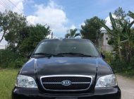 Kia Carnival GS 2006 - Bán Kia Carnival GS năm 2006, màu đen giá 219 triệu tại Tiền Giang