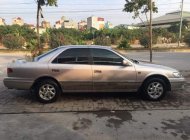 Toyota Camry  GLi 2001 - Cần bán Toyota Camry GLi 2001, màu bạc số sàn giá 250 triệu tại Hà Nội