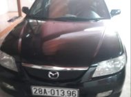 Mazda 323 2002 - Bán ô tô Mazda 323 đời 2002, màu đen giá 130 triệu tại Hòa Bình