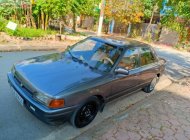 Mazda 323 1.6 MT 1996 - Cần bán Mazda 323 1.6 MT năm sản xuất 1996, màu xám  giá 65 triệu tại Hà Nam