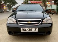 Chevrolet Lacetti EX 2012 - Bán ô tô Chevrolet Lacetti EX sản xuất 2012, màu đen giá 285 triệu tại Thanh Hóa