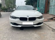 BMW 3 Series 320i 2014 - Cần bán xe BMW 320i 2014 ĐK 2015, số tự động màu trắng giá 915 triệu tại Tp.HCM