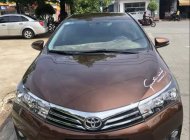 Toyota Corolla altis AT 2015 - Cần bán lại xe Toyota Corolla altis AT sản xuất 2015, màu nâu chính chủ giá 625 triệu tại Bình Dương