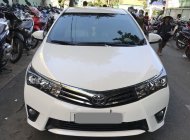 Toyota Corolla altis MT 2015 - Gia đình cần bán xe Altis 2015, số sàn, màu trắng giá 574 triệu tại Tp.HCM