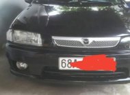 Mazda 323  MT 2000 - Cần bán gấp Mazda 323 MT năm sản xuất 2000, màu đen, xe nhà ít đi giá 125 triệu tại Kiên Giang