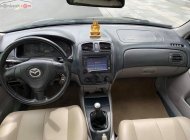 Mazda 323 2003 - Cần bán xe Mazda 323 đời 2003, màu đen, xe đẹp  giá 160 triệu tại Tuyên Quang